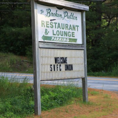 photo of sign the broken putter restaurant and lounge parking at sebasticook valley fcu golf tournament