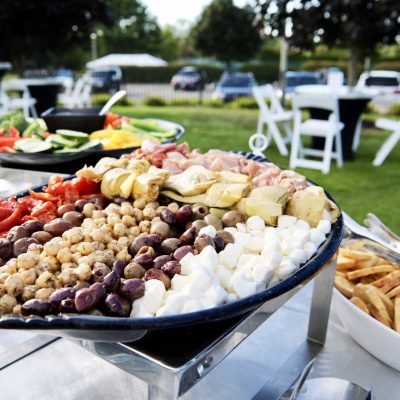 photo of hors d’oeuvres on table outside